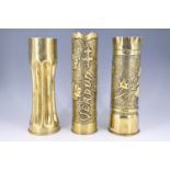 Three Great War shell case trench art vases / poker stands, comprising wriggle-work engraved and