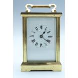 A mid-to-late 20th Century brass carriage clock, 8 x 6 x 12.5 with the handle down, [running when