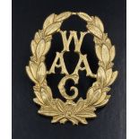A Great Women's Army Auxiliary Corps cap badge by Gaunt and bearing a numbered plaque verso