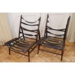 A pair of mid 20th Century Ercol model 427 easy chairs, bearing foil labels, 75 cm high