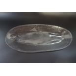 A late 20th Century pressed glass salmon dish, 50 cm