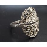 A vintage Art Deco style marcasite and white metal dress ring, stamped silver and tested as such,