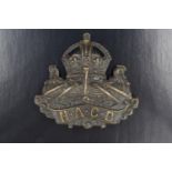 A Navy and Army Canteen Board cap badge