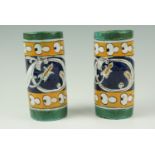 A pair of Iznik style earthenware cylindrical vases, impressed mark to the base, 14 cm, (a/f)