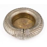 A nickel and brass "slave bangle" style dish, North Africa, 14 cm