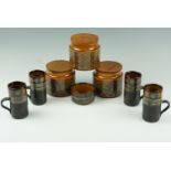 Three Hornsea Bronte kitchen storage jars together with a similar set of six coffee cans, etc,
