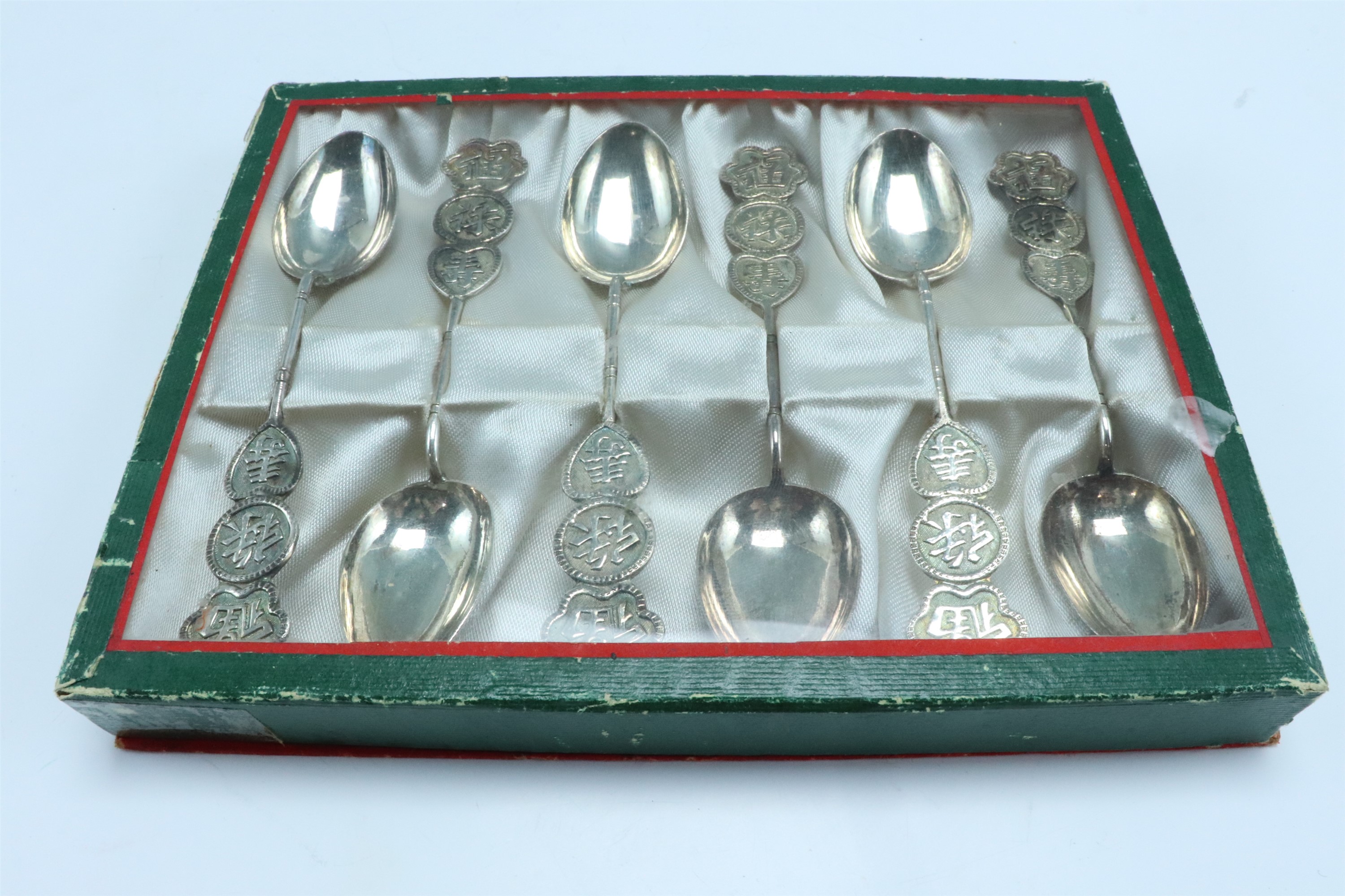 A set of six 1950s Chinese electroplated teaspoons, the handles decorated with Chinese