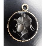 A late 20th Century carved sardonyx pendant, intaglio engraved in depiction of a Roman soldier,