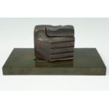 A modernist bronze sculpture bearing abstract depiction of hands clasping, part polished, finely