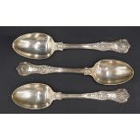 Three Victorian silver Queen's pattern dessert spoons, the terminals engraved with conforming