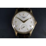 A 1950s Longines 9 ct gold wristwatch, having a calibre 12.68z manual wind movement and frosted