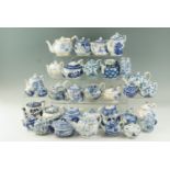 A quantity of Victorian and later miniature ceramic teapots, including European and Chinese