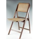 A late 20th Century caned oak folding chair