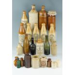 Various stoneware bottles including The Carlisle Old Brewery, etc