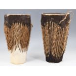 A pair of late 20th Century African cow skin covered drums, 13.5 x 25 cm
