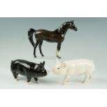 A Beswick horse together with two pigs, former 16 cm