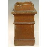 A salt-glazed earthenware chimney pot of tapering square section, 30 x 31 x 60 cm