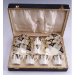 A cased set of George VI Royal Crown Derby coffee cans and saucers, bearing floral gilt