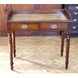 A late Victorian mahogany writing table, having two drawers and a later gallery, 91.5 x 49 x 82 cm
