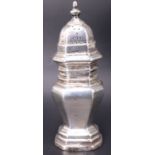 A George V silver pepperette retailed by Asprey, of octagonal baluster form with a slip-fit lid, the
