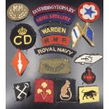 A group of largely Second World War British military and Civil Defence cloth insignia