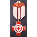 A British Red Cross Society Proficiency Medal with voucher dated 1940