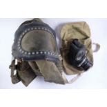 A Second World War British Home front baby's respirator together with a Civilian Duty gas mask and