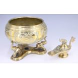 A SriLankan brass oil lamp, having an elephant form stopper and engraved decoration, together with a