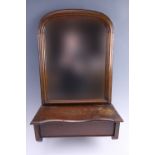 A William IV walnut hall mirror, having a brush box with a hinged lid to the base, 39.5 x 17.5 x