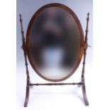 A late 19th / early 20th Century oval swivel dressing / toilet mirror, 45 x 25.5 x 68 cm