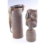 A Second World War French TC 38 gas mask and canister
