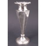 An Edwardian silver vase, of tapering hexagonal form and having gently fluted sides below a ribbed