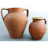 A late 20th Century terracotta two handled oviform vase, together with jug having slip