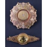 Two late Victorian 9 ct gold brooches, respectively having a rose cut diamond surrounded by an