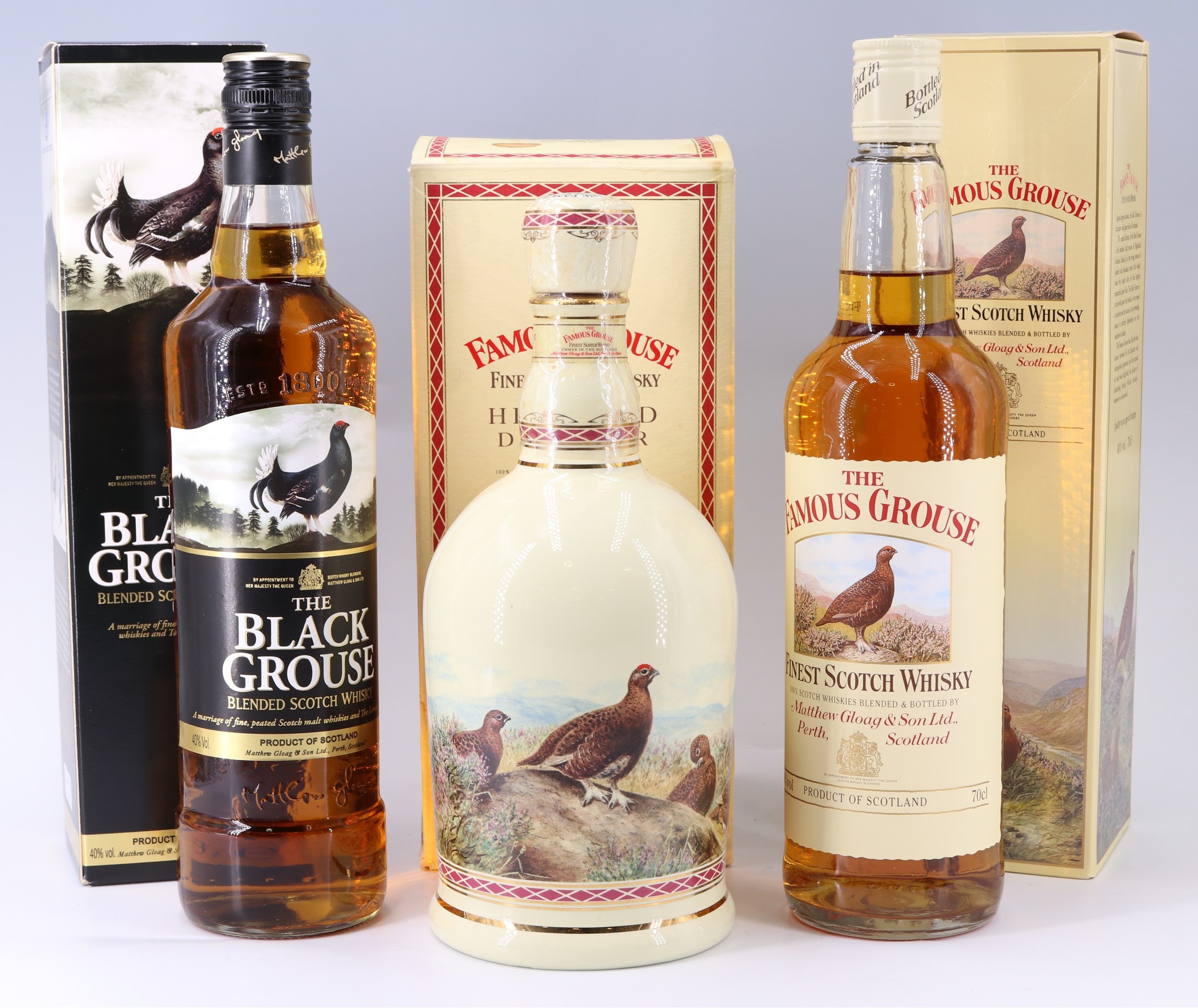 The Famous Grouse Highland Decanter of whisky, together with a boxed 700 ml bottle and a boxed 700
