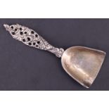 A continental silver caddy spoon, having pierced and cast rococo influenced handle, import marks