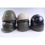 A quantity of post-War world military helmets