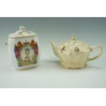 A commemorative King VI coronation teapot together with a Queen Elizabeth II 1952 - 2002 biscuit