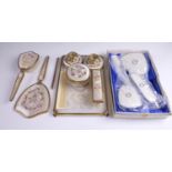 A late 20th Century gilt metal and petit-point dressing table set together with a similar boxed set,