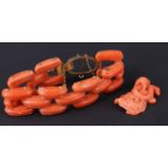 A Victorian carved coral flexible bracelet, having a yellow metal clasp, (the latter lacking a