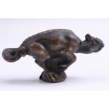 An early 20th Century patinated cast bronze figure of a writhing dragon, 8.5 cm long