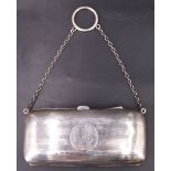A George V silver finger purse, the engine turned exterior having an engraved monogram, hide