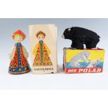 Two boxed vintage clockwork tinplate toys, comprising a Russian doll and a Spanish walking bear,