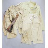 A Royal Artillery officer's khaki drill tunic, a Sam Browne belt and two other KD tunics, circa