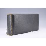 An early 20th Century calf skin photograph album, having gilt-edge boards, 24 pages, 28 x 15 x 6 cm