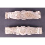 A pair of Victorian hinged engraved white metal napkin or scarf rings, 5 cm