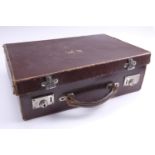 A small vintage leather travel case, satin lined, the lid having gilt embossed 'B W', 36.5 x 26 x 10