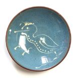 A Lamorna Pottery pin dish, decorated in depiction of a cormorant, 10.5 cm diameter