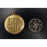 An early 20th Century gold plated pendant locket decorated with an engraved and paste-set