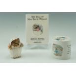 A Royal Doulton Miss Tiggy Winkle figurine together with a Wedgwood Beatrix Potter money box and a